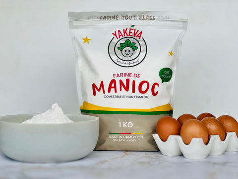 A hand scooping pale cassava flour from a bag into a mixing bowl, prepping a nut-free batch of muffins for a lunchbox.